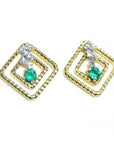 A pair of 14K yellow gold emerald post earrings with round cut Colombian emeralds set in a double frame rope decoration.
