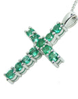 A Colombian emerald cross pendant necklace on a side position top and gallery shown.