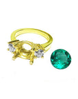 18K yellow gold three-stone ring setting with two round diamonds and a separate 2.44 ct. Colombian emerald.