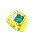 Men's 18K yellow gold ring with a rectangular emerald-cut Colombian emerald and channel-set princess diamonds.