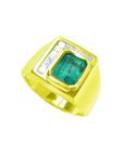 Men's 18K yellow gold ring with a rectangular emerald-cut Colombian emerald and channel-set princess diamonds.