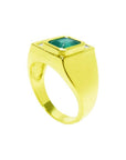 Men's 18K yellow gold ring with a rectangular emerald and two princess-cut diamonds.