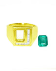 Men's 18K yellow gold ring with channel-set diamonds and a loose rectangular Colombian emerald.