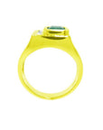 Men's 18K yellow gold ring with a rectangular emerald and channel-set princess-cut diamonds.