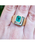 A genuine colombian emerald bezel set and natural princess cut natural diamonds in a 18k yellow gold ring for men.