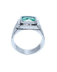 Men's 18K white gold ring with a bezel-set, modified emerald-cut deep bluish-green Muzo Colombian emerald.