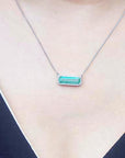 Real Emerald necklace elongated natural Colombian emerald 3.48 carats east west orientation encircle by halo diamonds