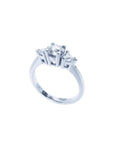 14K white gold engagement ring with a round center diamond and two trillion side diamonds.