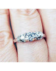 Round cut diamond engagement ring three stone crafted in 14k white gold.