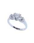14K white gold three-stone engagement ring with round cut natural diamonds and pave accents.