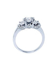 Round cut three stone diamond engagement ring in 14K white gold with pave set accent diamonds.