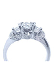 14K white gold three-stone round cut diamond engagement ring with pave accent diamonds.