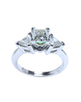 14K white gold ring with a princess cut diamond center and trillion side diamonds.