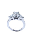 14K white gold ring with a princess cut diamond center and two trillion side diamonds.