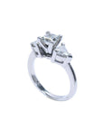 14K white gold ring with a princess cut diamond center and two trillion side diamonds.