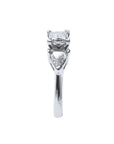 14K white gold ring with a princess cut diamond flanked by two trillion side diamonds.
