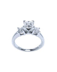White gold 14K three-stone princess cut diamond ring with a central stone and two side diamonds.