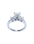 White gold 14K three-stone princess cut diamond ring with a central stone and two side diamonds.