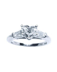 14K white gold heart-cut diamond engagement ring with side baguette diamonds.
