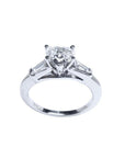 14K white gold heart-cut diamond engagement ring with side tapered baguette diamonds.