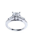 14K white gold heart-cut diamond engagement ring with side tapered baguette diamonds.