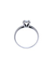 Round cut diamond solitaire engagement ring in 14K white gold with an illusion setting.