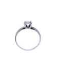 Round cut diamond solitaire engagement ring in 14K white gold with an illusion setting.