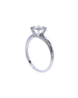 Round cut diamond solitaire engagement ring in 14K white gold with an illusion setting.