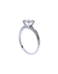 Round cut diamond solitaire engagement ring in 14K white gold with an illusion setting.