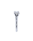 Round cut diamond solitaire engagement ring in 14K white gold with an illusion setting.