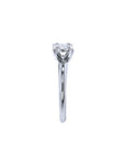 Round cut diamond solitaire engagement ring in 14K white gold with an illusion setting.