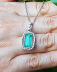 Unique emerald earrings and pendant
