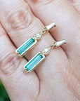 May birthstone baguette emerald earrings