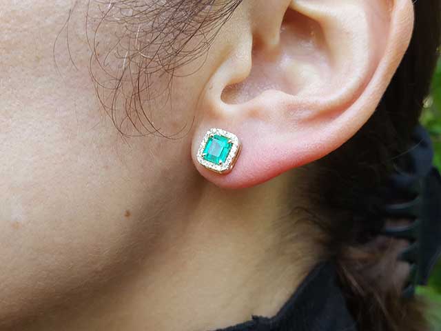Halo emerald-cut emerald stud earrings