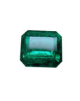 Faceted loose emerald gemstone on a white background