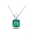 GIA certified Colombian emerald pendant with diamond halo in 18K white gold.