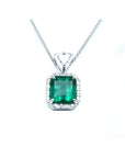 GIA certified Colombian emerald pendant with diamond halo in 18K white gold.