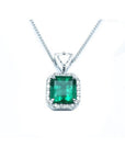 GIA certified Colombian emerald pendant with diamond halo in 18K white gold.