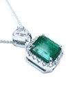 A GIA certified F1 colombian emerald pendant, crafted in 18k white gold.