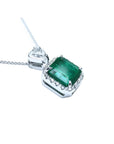 A GIA certified F1 colombian emerald pendant, crafted in 18k white gold.