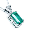 Emerald pendant necklace on a white background displaying the gallery perspective.