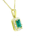 0.75 ct. GIA certified F1 Colombian emerald pendant in 18k yellow gold with diamond halo.