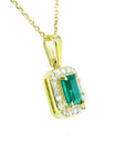0.75 ct. GIA certified F1 Colombian emerald pendant in 18k yellow gold with diamond halo.