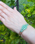 Real emerald bangle bracelet yellow gold