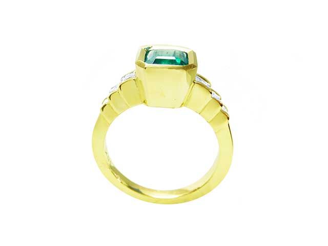 Three stone emerald engagement rings