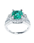 Cushion cut emerald halo diamond engagement ring