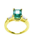 Emerald three stone engagement rings
