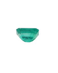 Natural loose colombian emerald displaying the underside.