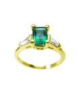 A natural emerald ring topside view with side diamonds, the May's birthstone jewelry.