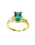A natural colombian emerald ring with side baguette diamonds, the May's birthstone jewelry.